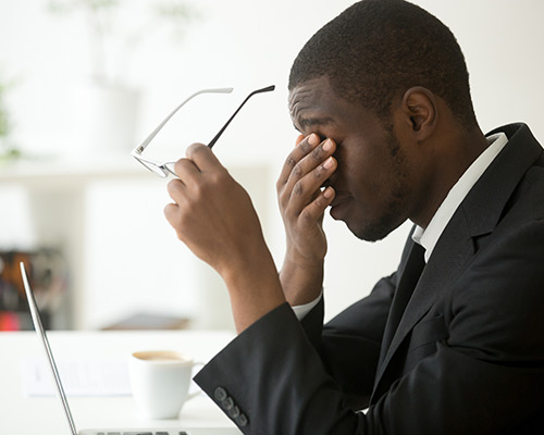 Man rubbing his eyes